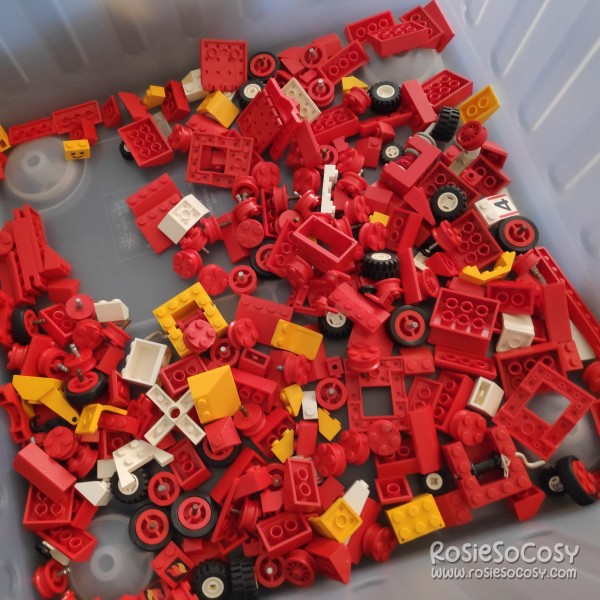 New batch of old LEGO bricks and parts. Mostly red bricks, some yellow, some wheels.