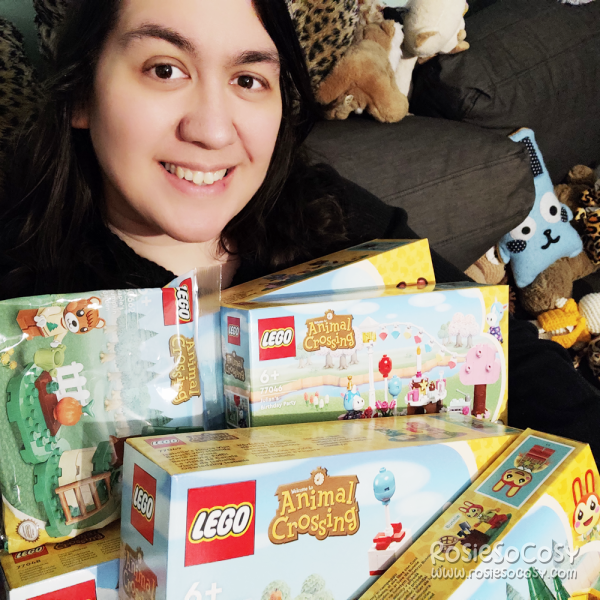 Rosie is holding all the new Animal Crossing LEGO sets