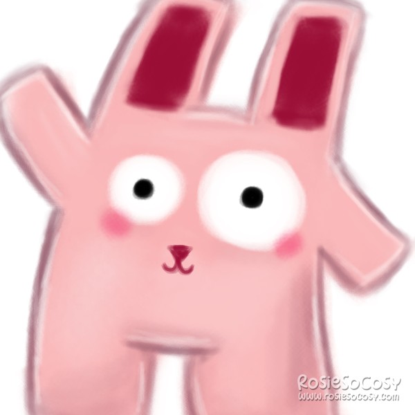 A pink Freezer Bunny with wonky eyes. Freezer Bunny is waving at the camera.