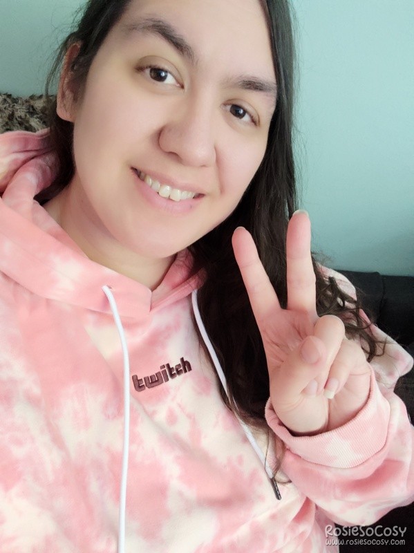 Rosie wearing the pink tie dye Twitch hoodie