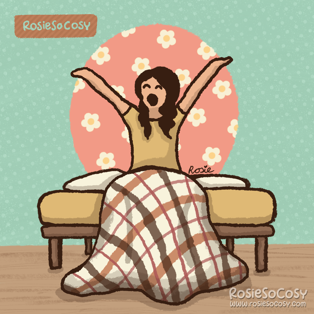 A brunette girl sitting on a bed, stretching and yawning. She's wearing a yellow shirt and her blanket has a cream/brown plaid pattern. The wallpaper is seafoam with dots. Behind her bed is a big pink circle with a daisy pattern on it.