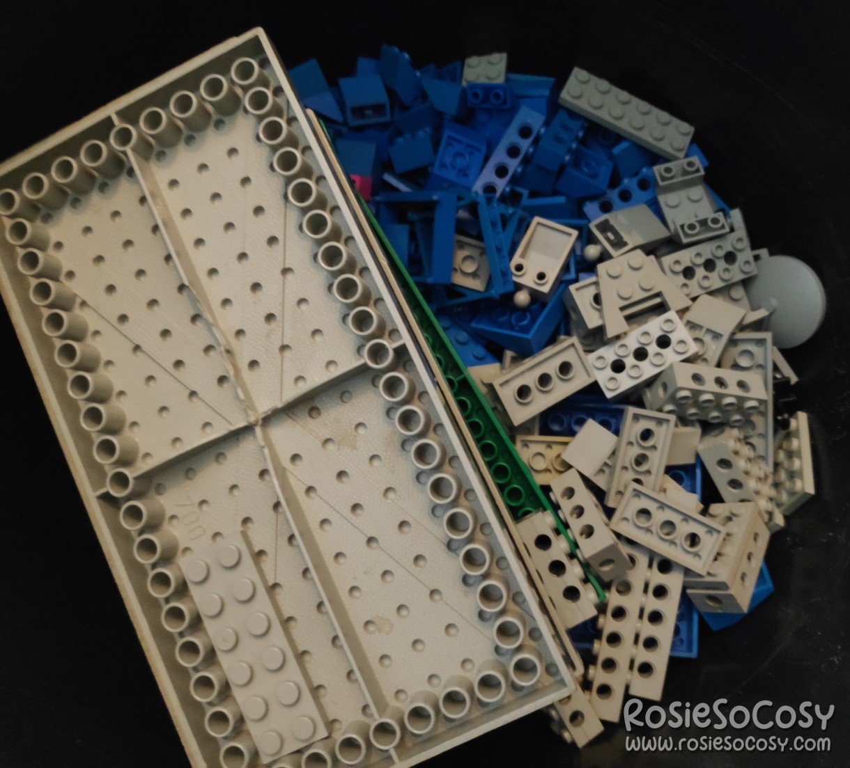New batch of old LEGO bricks and parts. Inside a black bucket, blue and light grey LEGO from the 80s.